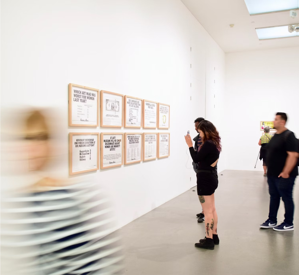 Photo of people taking photos at an exhibit